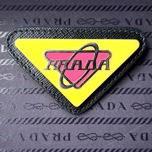 Prada Triangolo Leather Pin & Brooch